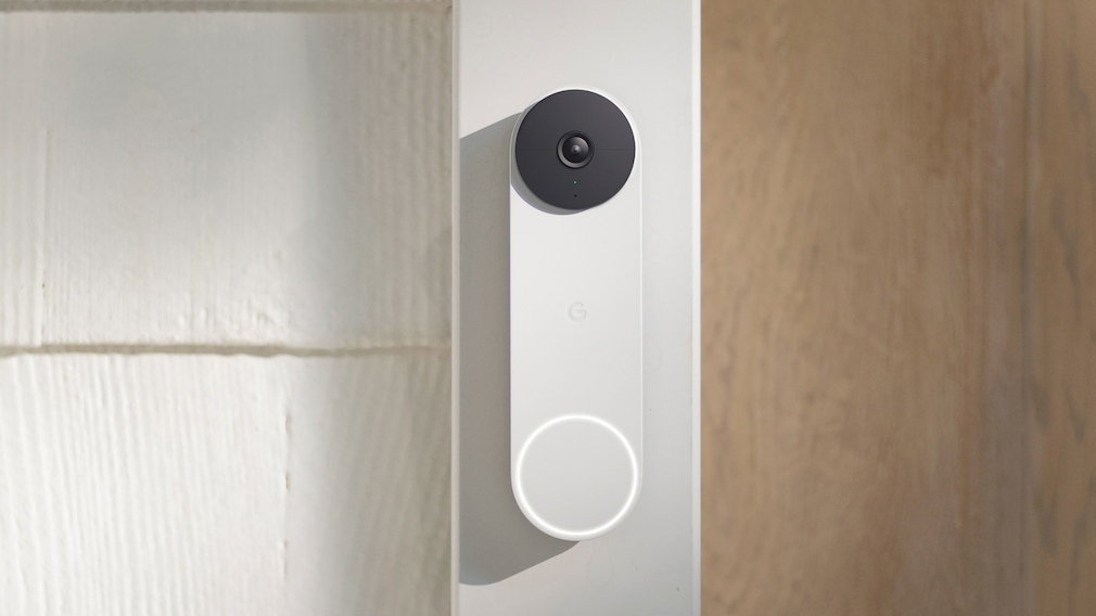 Smart doorbell hanging on a wall.