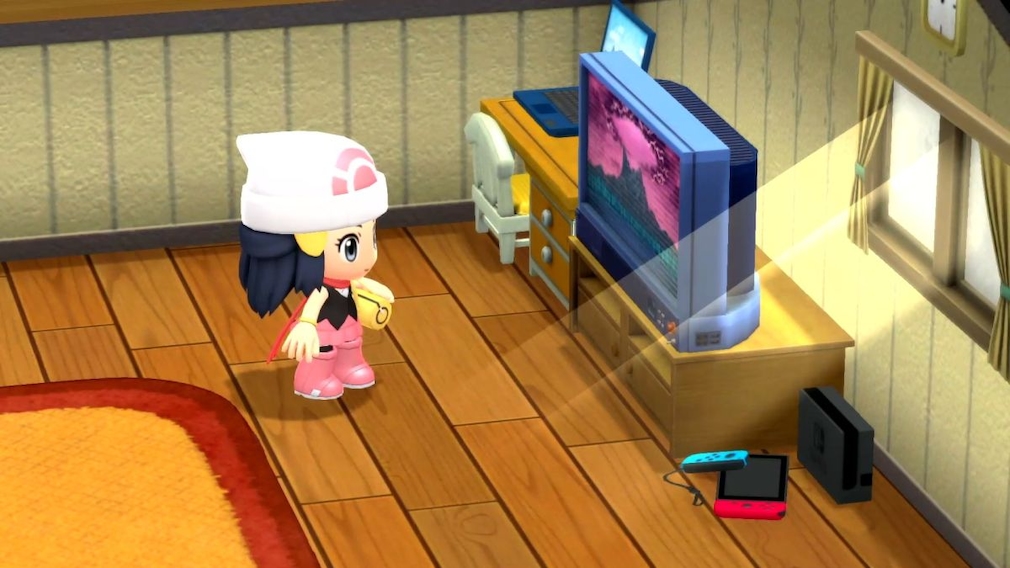 Ein Mädchen steht vor einem Fernsehen und einer Spielekonsole.