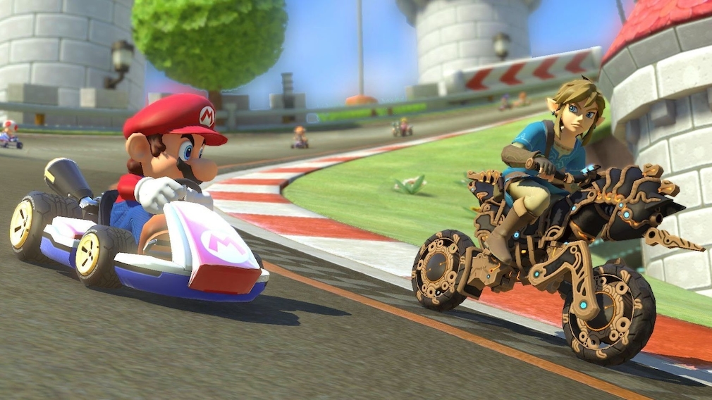 Mario in his racing car overtakes Link on a motorcycle.