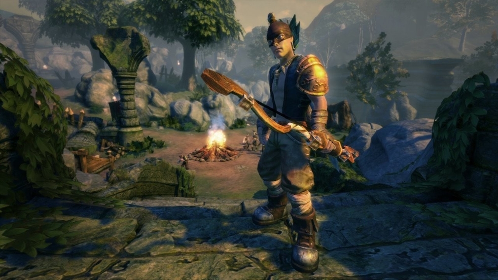An archer stands in front of a campfire in the wild.