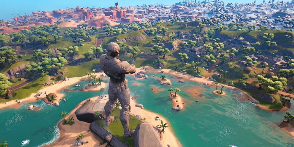A colossal statue looks out over an island.
