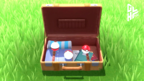 Ein geöffneter Koffer mit Pokémon-Items im Gras. © The Pokémon Company / Nintendo