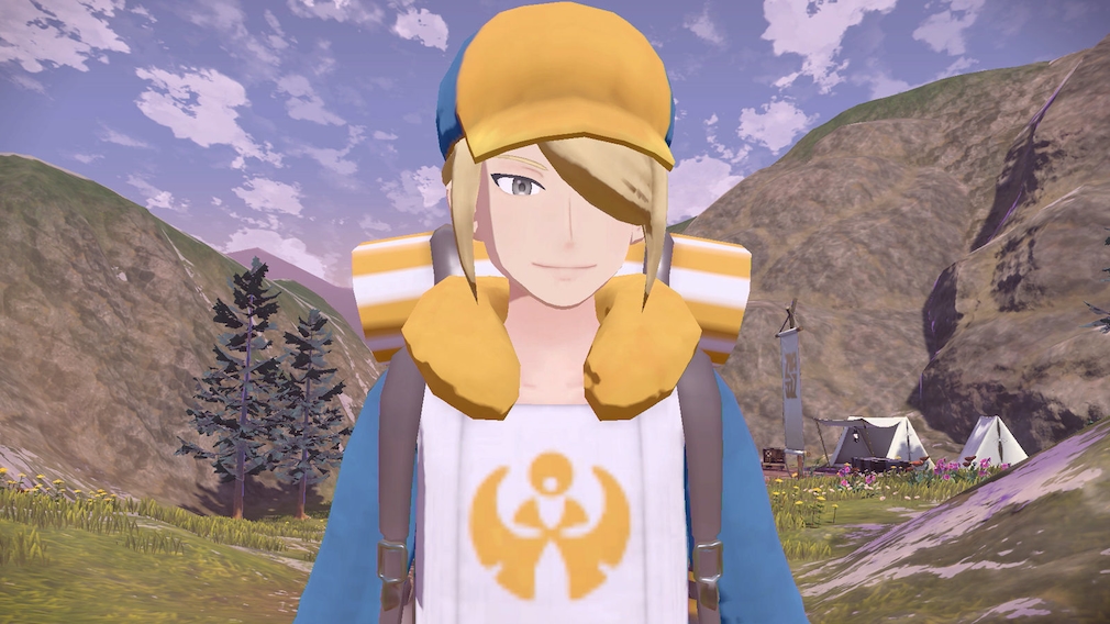A blond man in yellow, white and blue clothes.