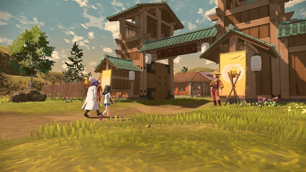 Two people enter a village through a gate.