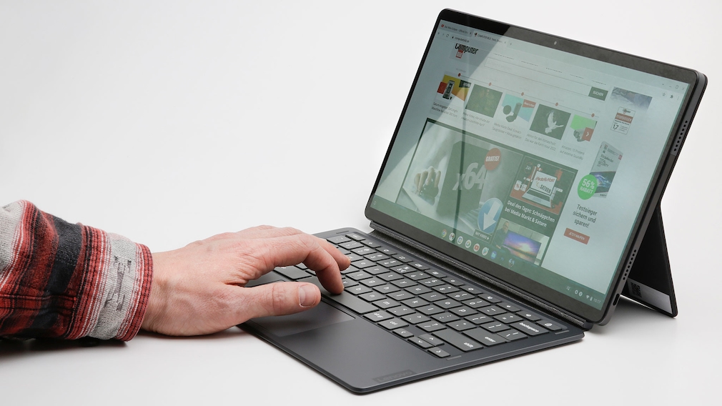 Hand typing on the keyboard of the Lenovo IdeaPad Duet 5 Chromebook.