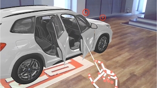 Ein virtuelles BMW-Fahrzeug steht in einem Raum.