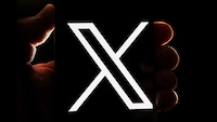 X in einer Hand