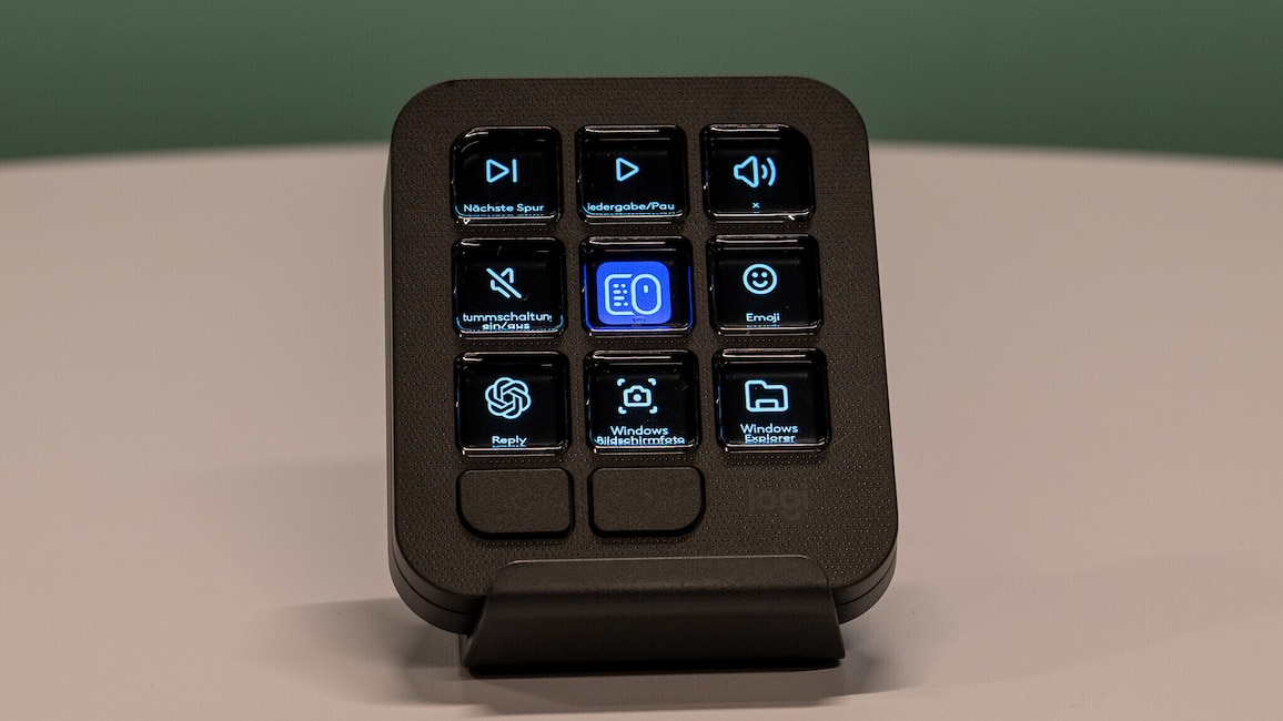Ansicht des MX Keypad auf einem weißen Tisch. Auf dem Display sind neun Symbole für Funktionen zu sehen.