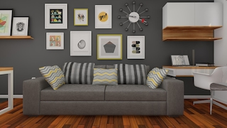 Wohnzimmer mit Sofa und Bildern