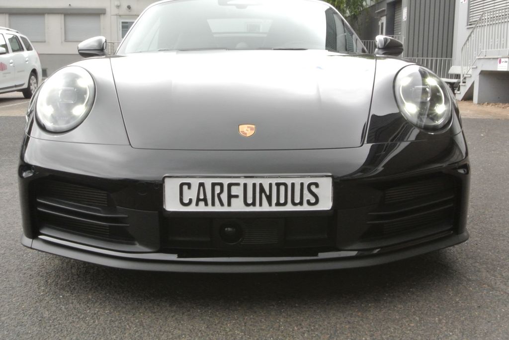 Bild des Angebotes Porsche 992 cab,schw/schw,21",abgas,chrono,bose,acc,sofo