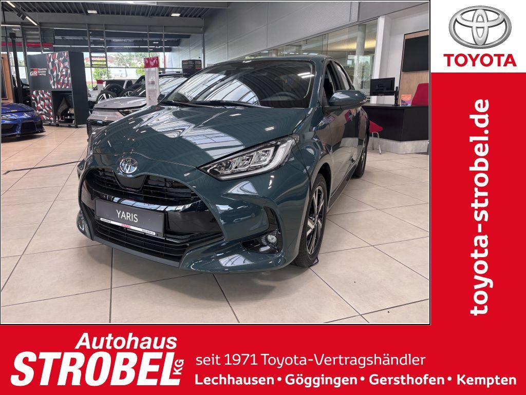 Bild des Angebotes Toyota Yaris Hybrid 116 1.5l Teampl. Safety Paket + Com